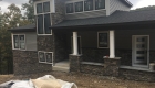 Stone and siding complete