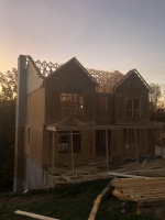 Framing house and setting trusses